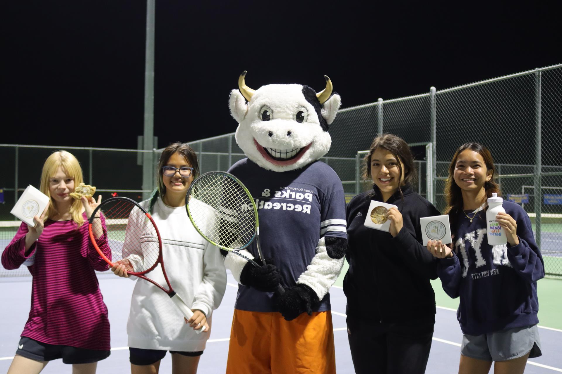 West Sac Parks and Rec mascot, Mooie, posing with tennis players